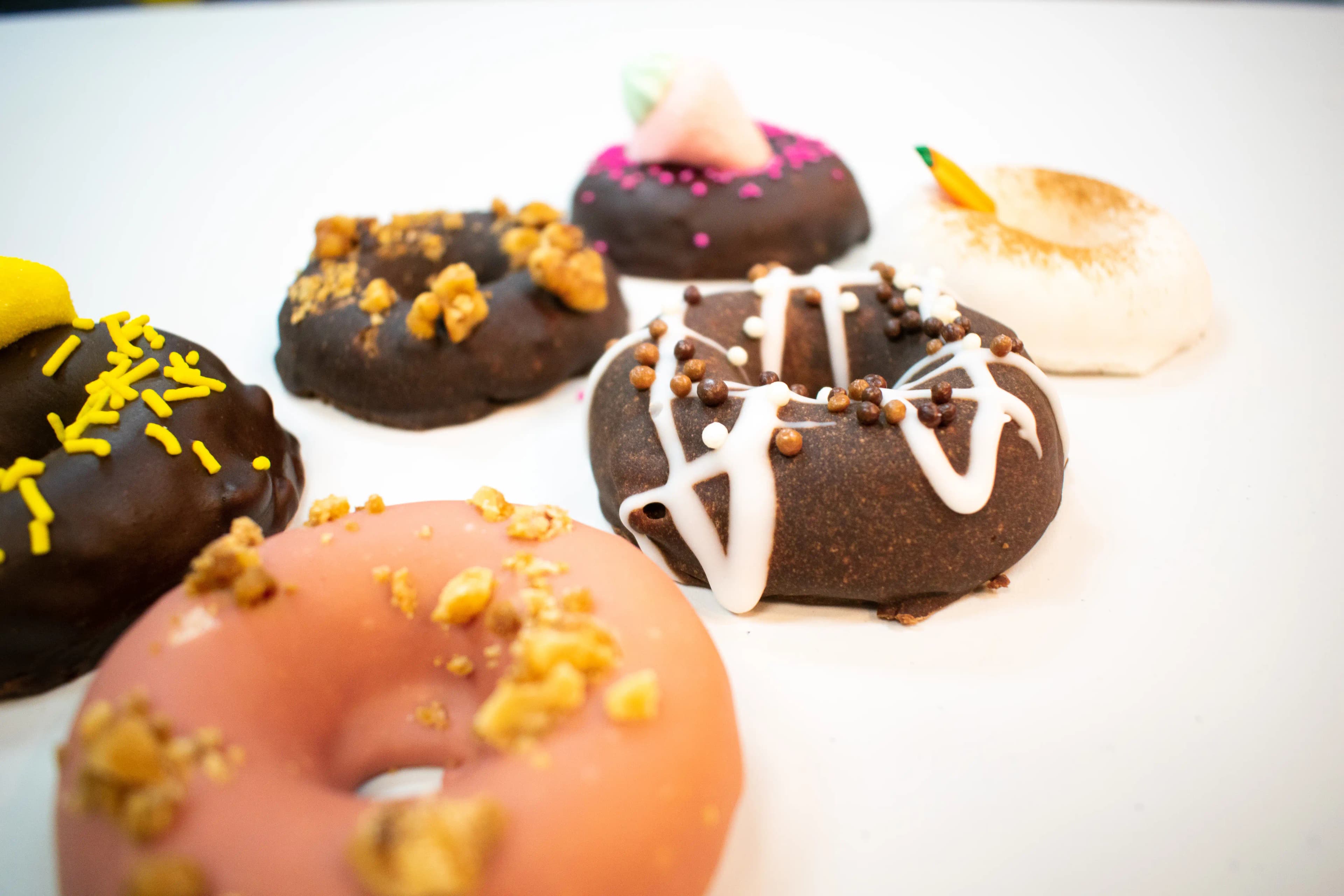 Six donuts on a white background.